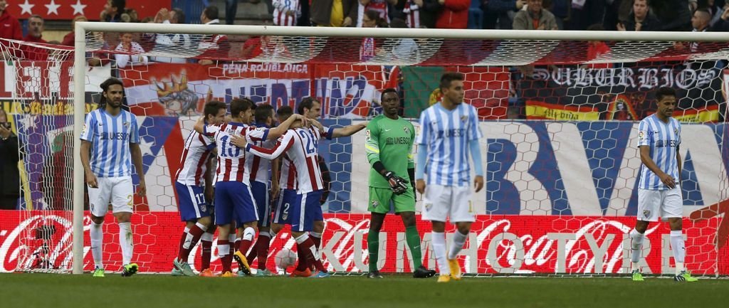 Los jugadores del Atlético celebran el definitivo 3-1, obra de Godín.