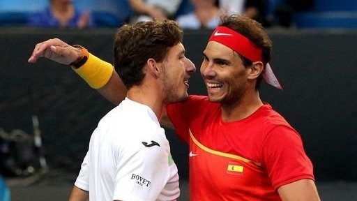 Carreño y Nadal celebran la victoria en el partido de dobles.